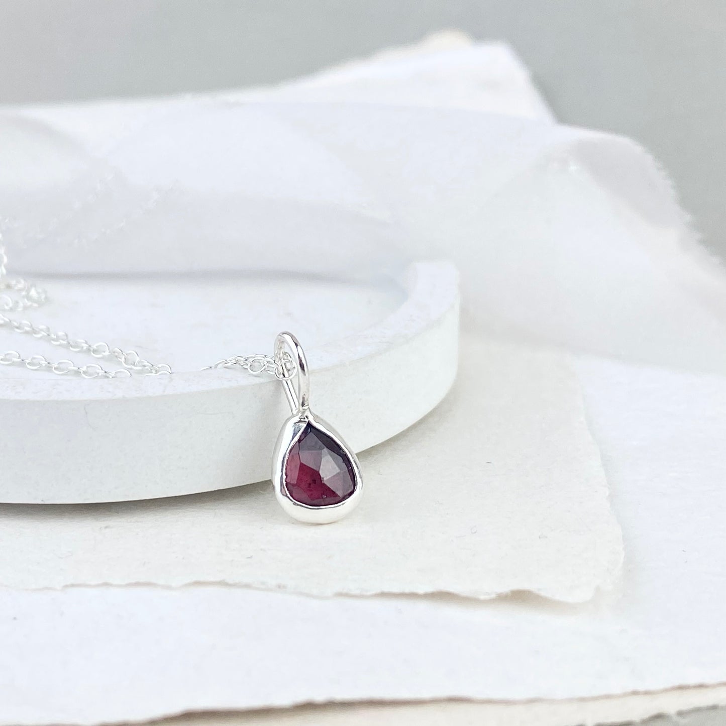 Silver and garnet pendant