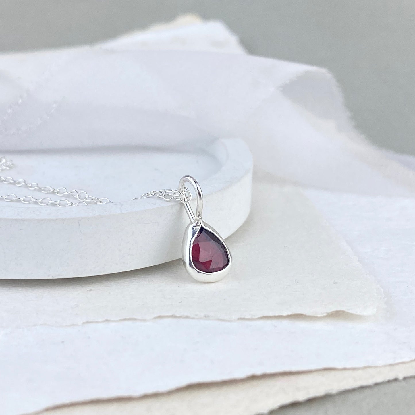 Silver and garnet pendant