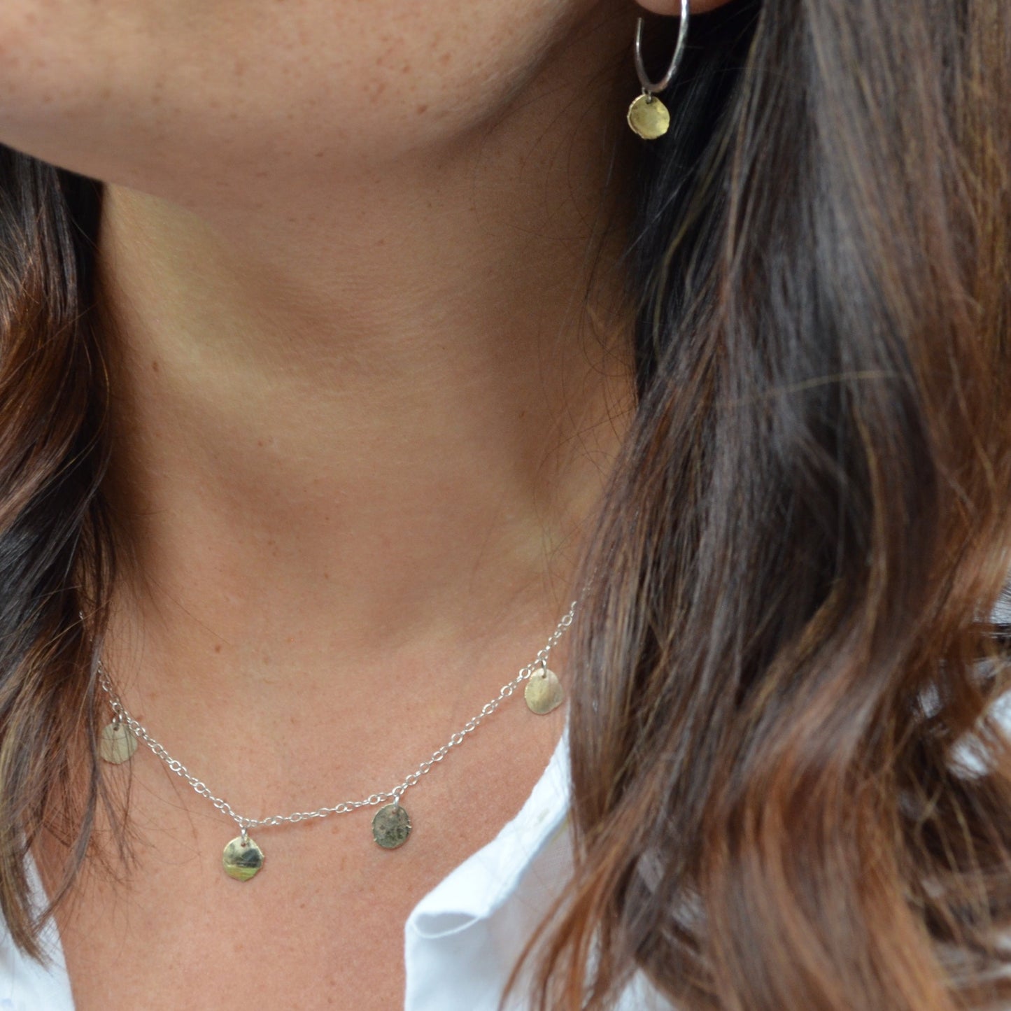 Silver and gold necklace and earrings
