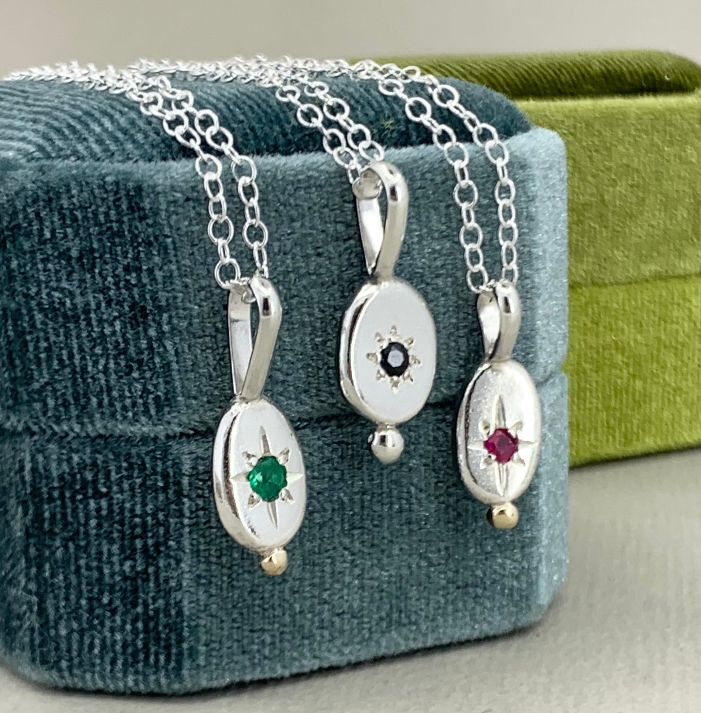 Star set pendant with emerald, sapphire or ruby