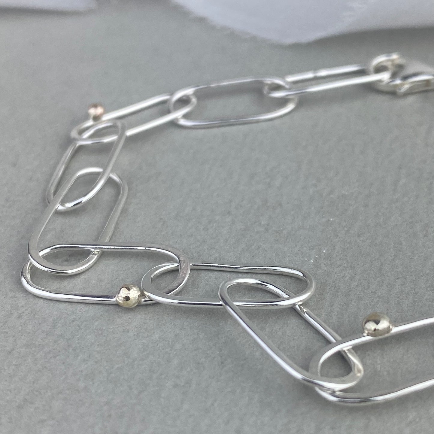 Handmade silver link bracelet with gold detail