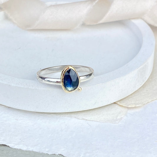 Blue sapphire ring set in gold and silver 