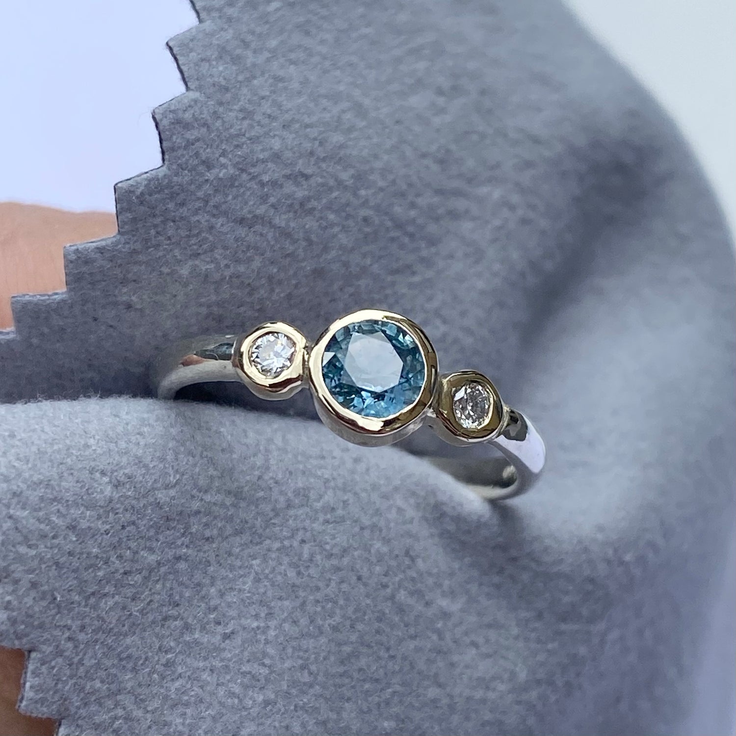 Teal sapphire and diamond ring set in yellow and white gold 