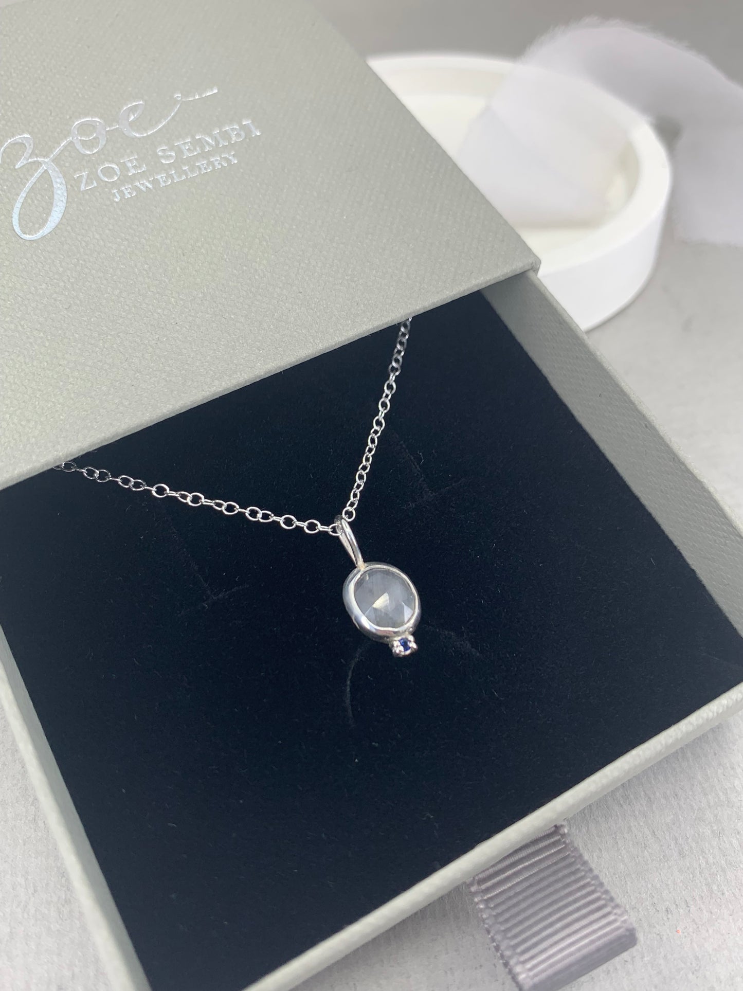 Grey and blue sapphire pendant