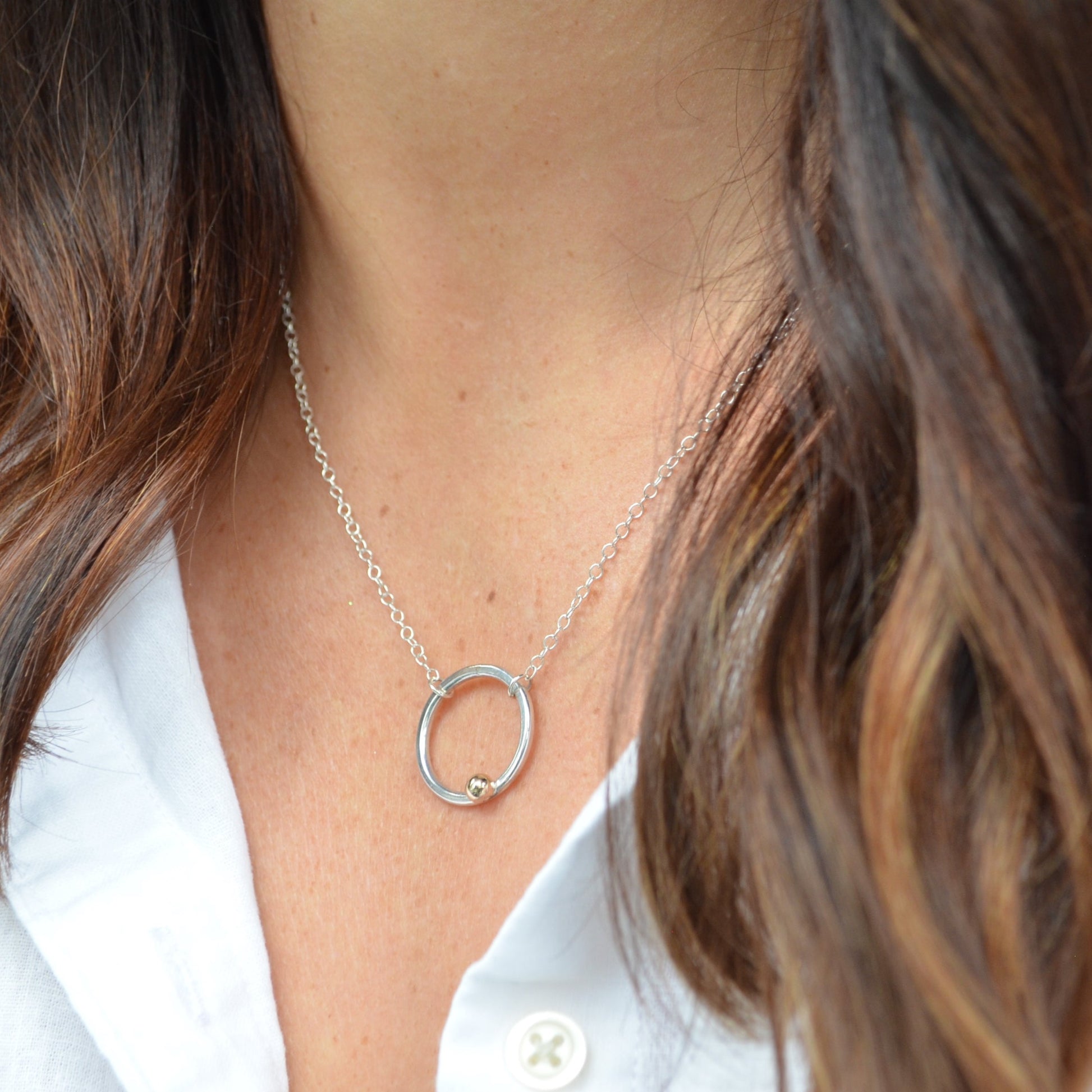 Silver hoop necklace with gold detail 