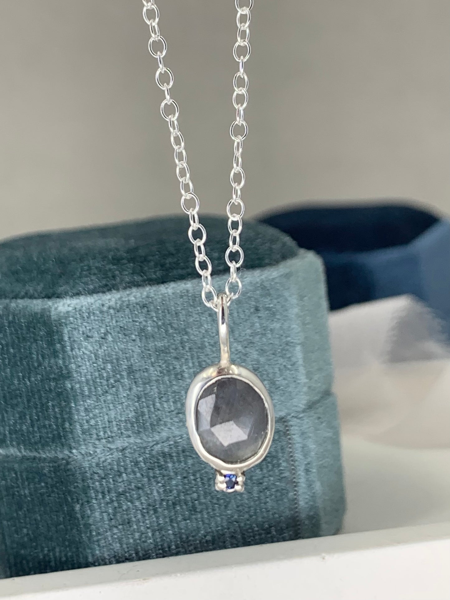 Grey and blue sapphire pendant