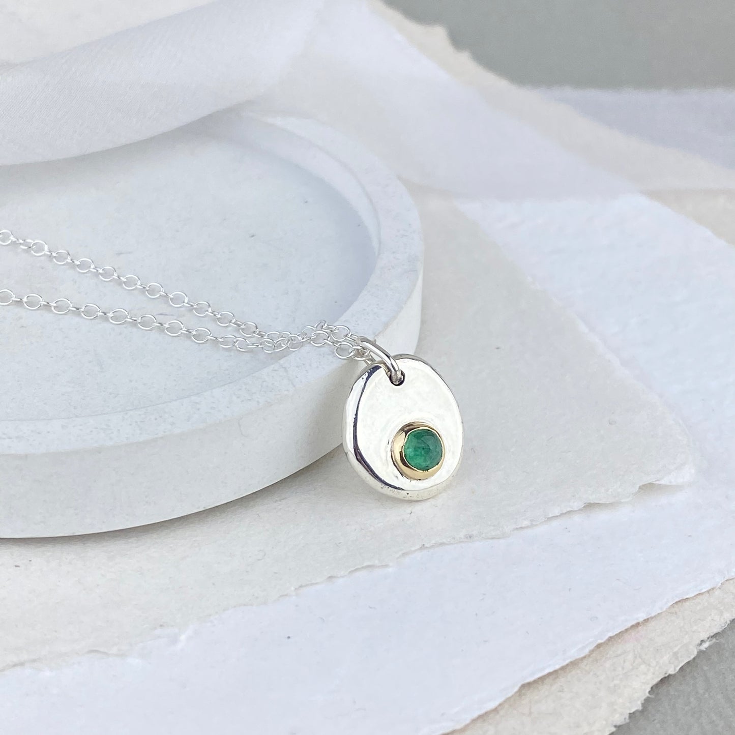 Emerald pendant in silver and 9ct gold