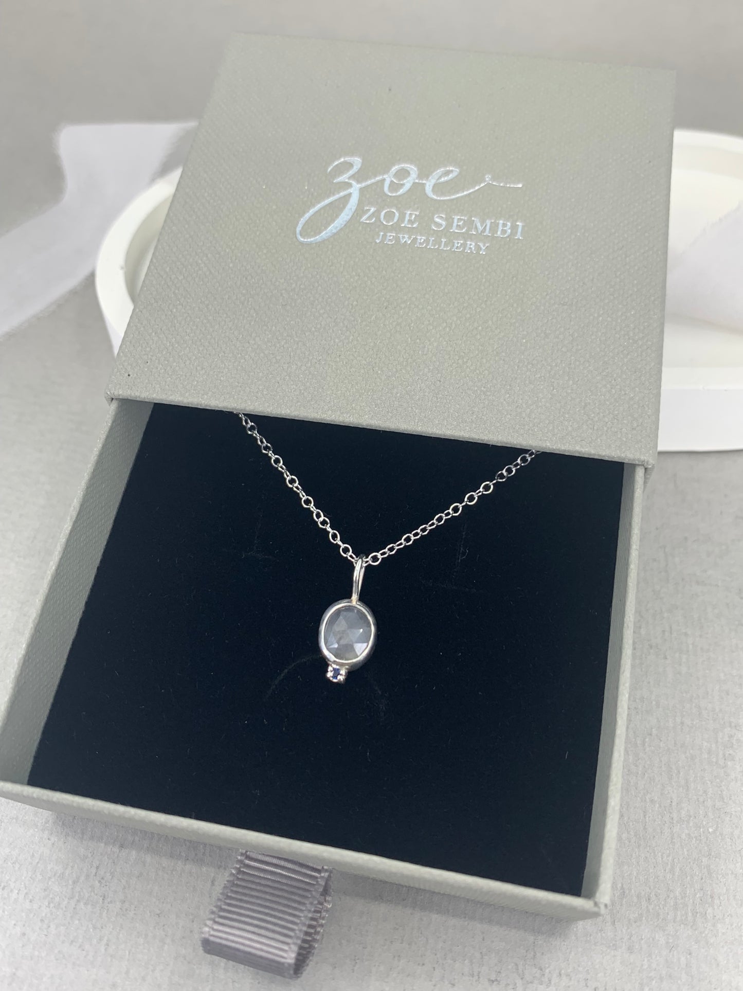 Grey and blue sapphire pendant