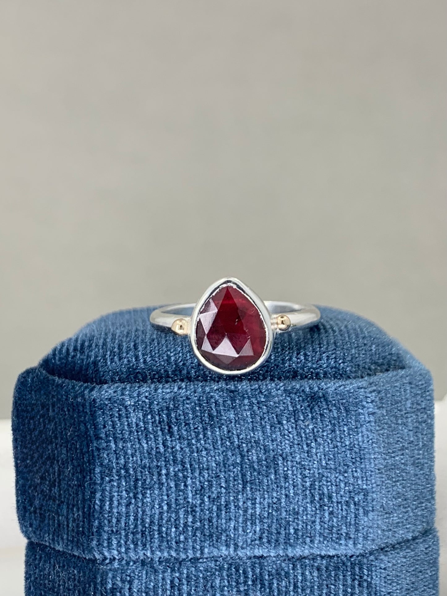 Garnet ring in sterling silver with 9ct gold detail
