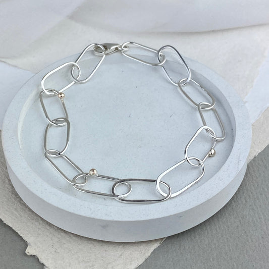 Handmade silver link bracelet with gold detail