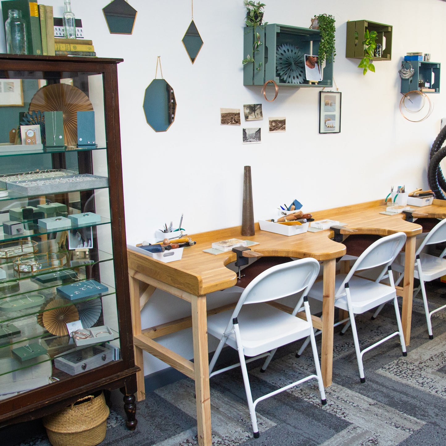 Jewellery Workshop with wooden tables, chairs, and various tools and materials.