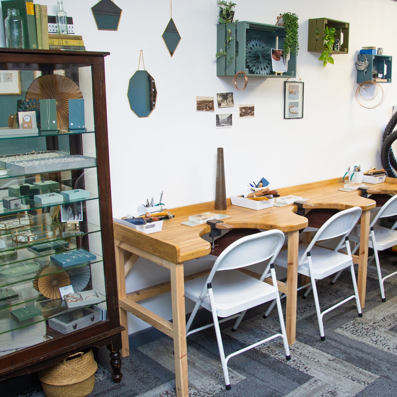 Jewellery Workshop with wooden tables, chairs, and various tools and materials.