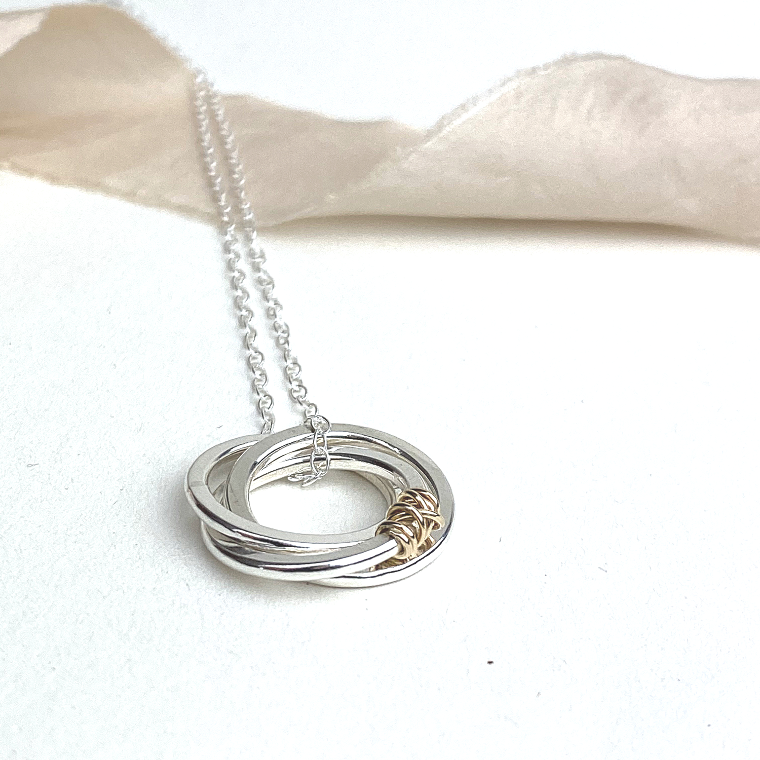 The Tanner Hoop Necklace - sterling silver hoop necklace with 12ct filled gold twist - entwined Russian style interlinked rings