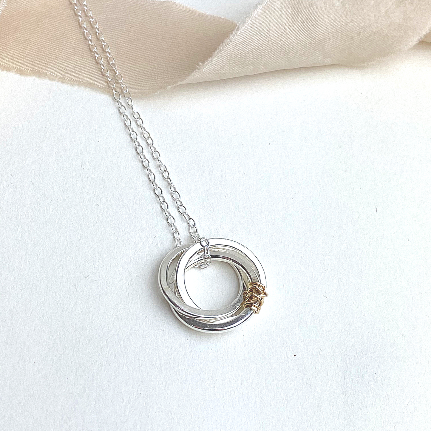 The Tanner Hoop Necklace - sterling silver hoop necklace with 12ct filled gold twist - entwined Russian style interlinked rings